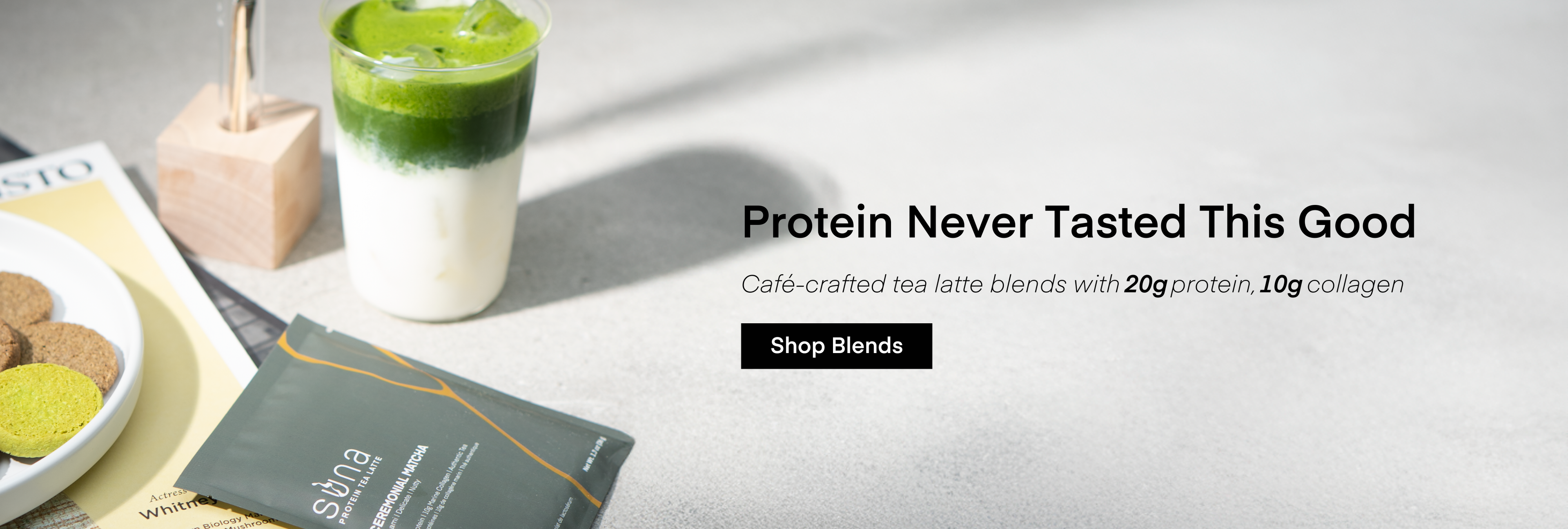 Cafe-crafted protein tea latte blend with protein and collagen, displayed on a light surface.